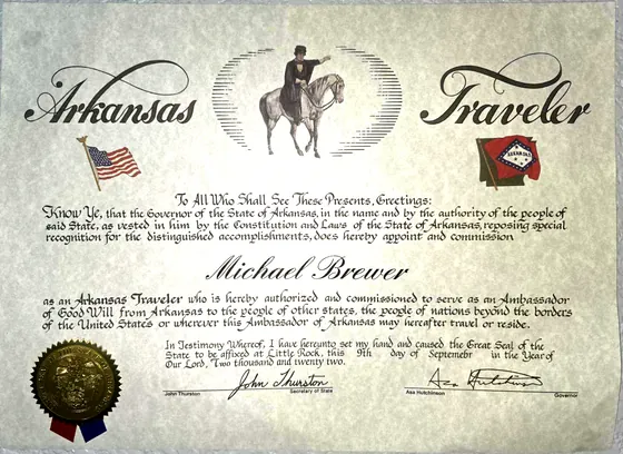 Arkansas Traveler certificate commissioning Michael Brewer as an ambassador of good will, signed by Governor Asa Hutchinson on September 9, 2022.