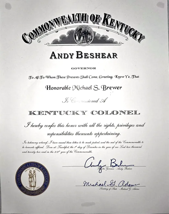Commission from the Commonwealth of Kentucky naming the Honorable Michael S. Brewer a Kentucky Colonel, signed by Governor Andy Beshear on December 1, 2022.